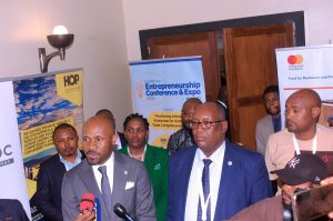 Nation Media Group CEO Stephen Gitagama (foreground right) and DR Congo Information and Communication minister Patrick Muyaya (L) address journalists at the East African Entrepreneurship Conference & Expo in Kinshasa. Picture: Pool